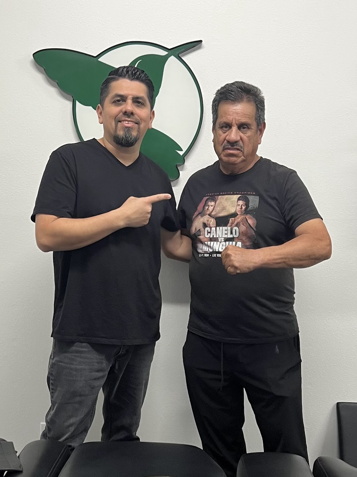 Dr. Sam with a legendary boxing trainer at the clinic