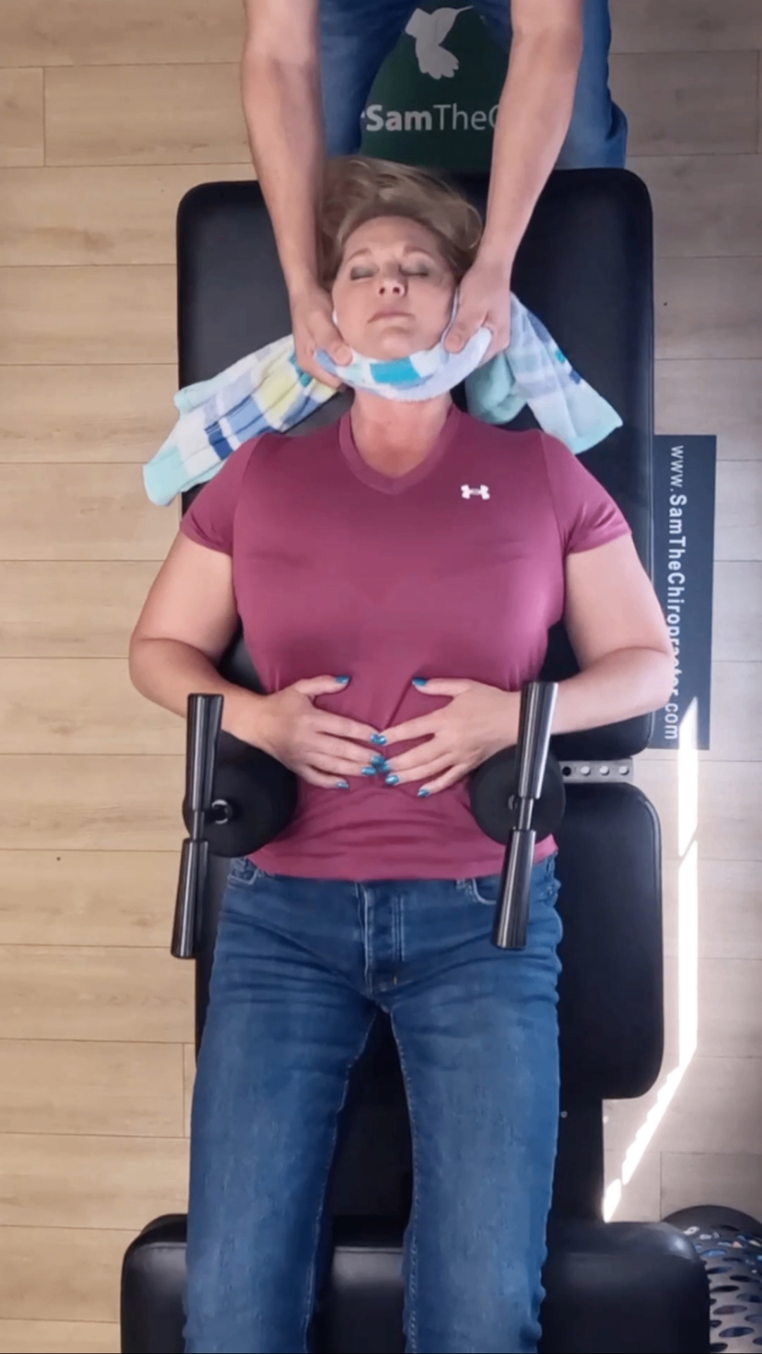 Patient receiving a Ring Dinger® decompression adjustment