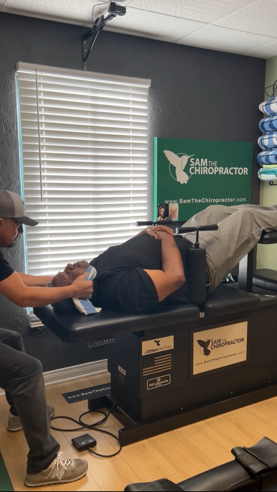 Side view of a patient on the Hill Laboratories table mid-adjustment