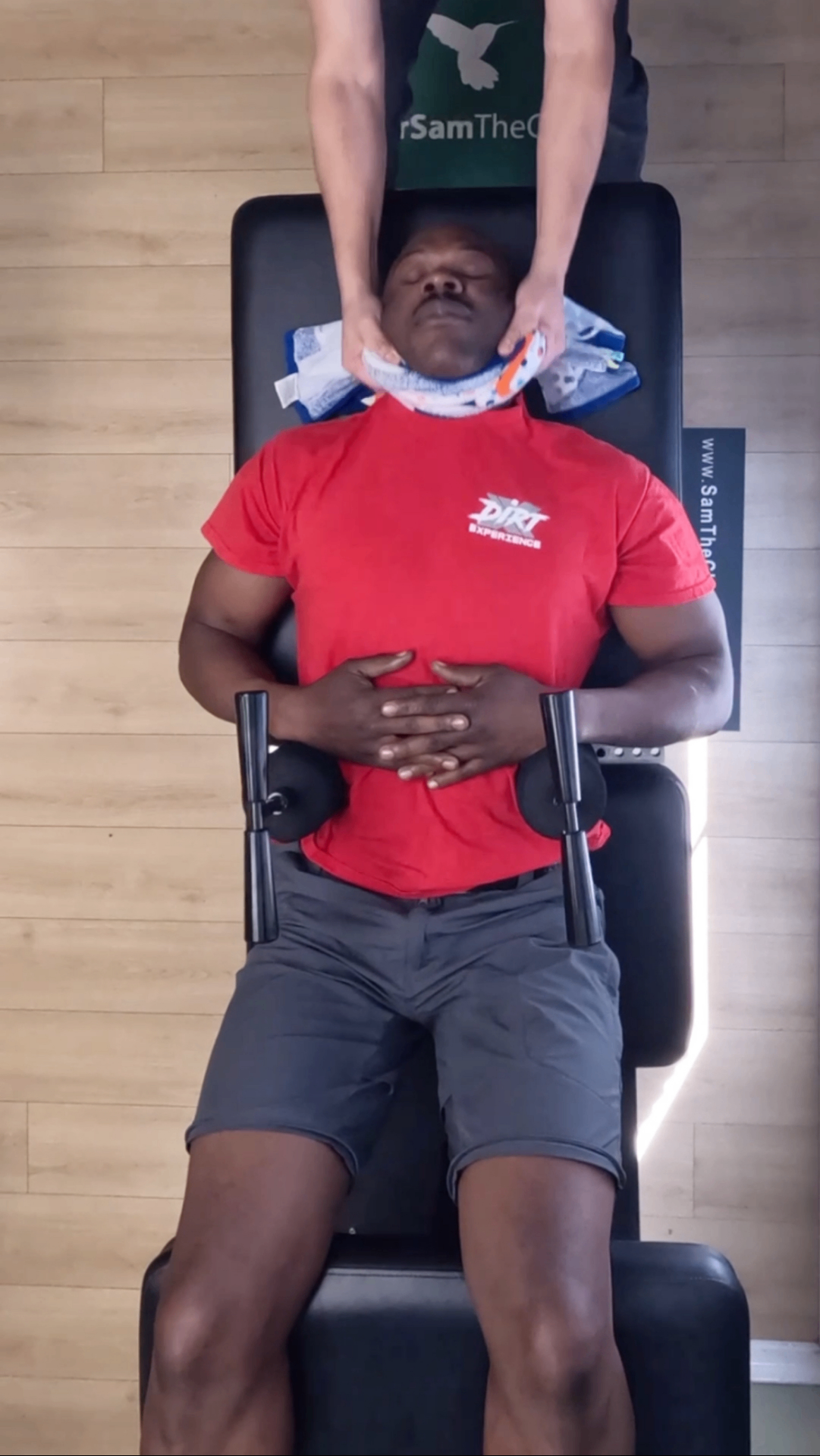 Athlete in a Dirt Experience shirt receiving a Ring Dinger® decompression