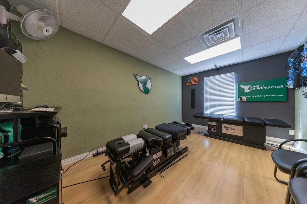 Inside the Sam The Chiropractor treatment room with the hummingbird logo